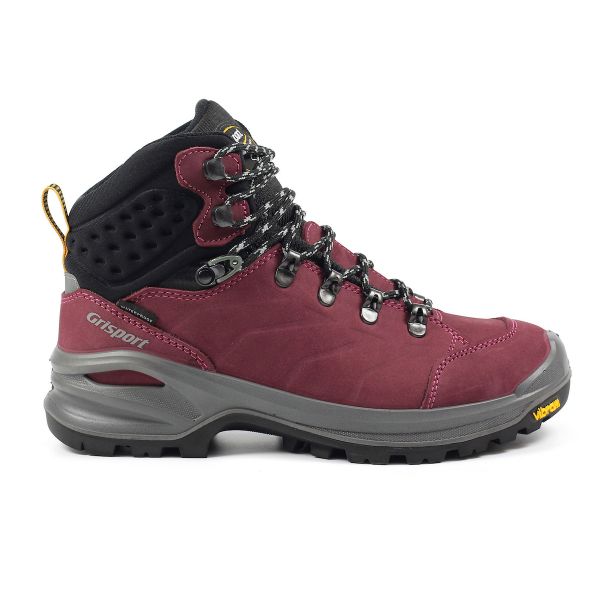 A burgundy mid-cut hiking boot with a black padded ankle collar, metal lace hooks, and a rugged grey Vibram sole, branded ‘Grisport’ on the side.
