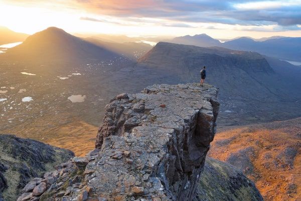 MAN ON SCOTTISH MOUNTAIN PRECIPICE]