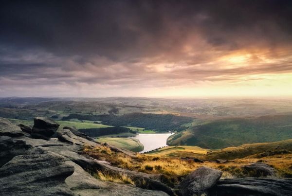 The view from the top of Kinder Scout, looking over a lake and hills