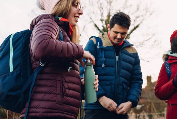 Woman opening water bottle