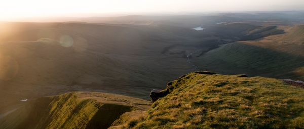 View from Pen y Fan, looking across grassy peaks