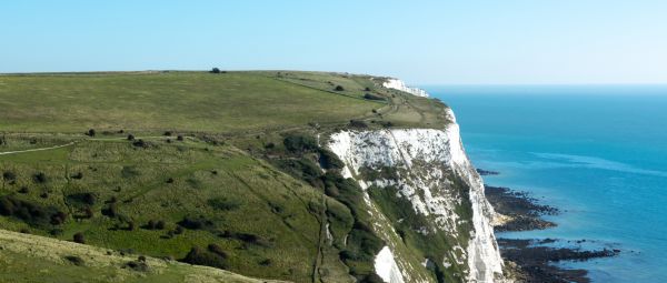 View along grassy white chalk cliff tops